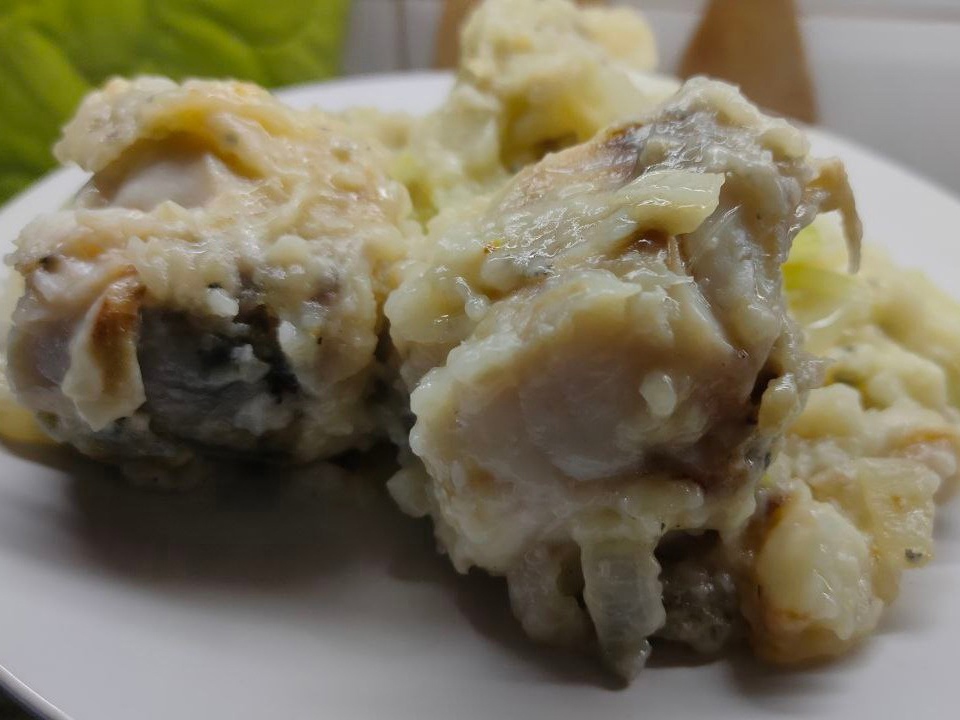 Pollock with Onions in a Skillet