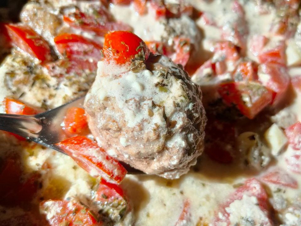 Beef and Chicken Meatballs Stewed with Tomatoes and Garlic in Sour Cream Sauce