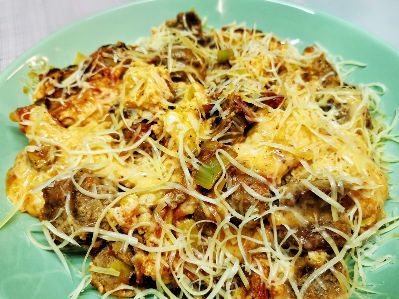 Cheesy Scrambled Eggs with Sausages and Olives