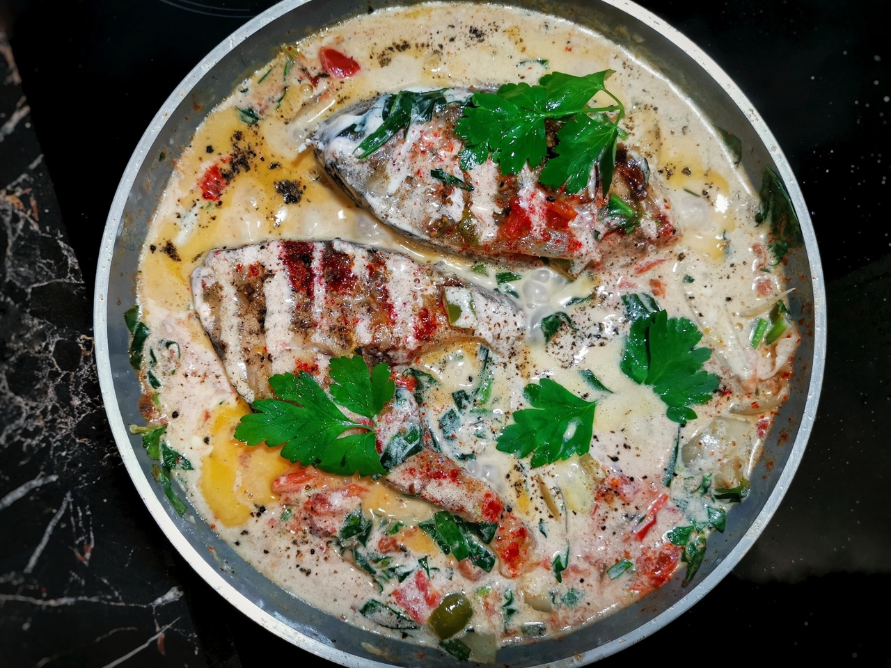 Carp Steak on a Creamy Vegetable Bed